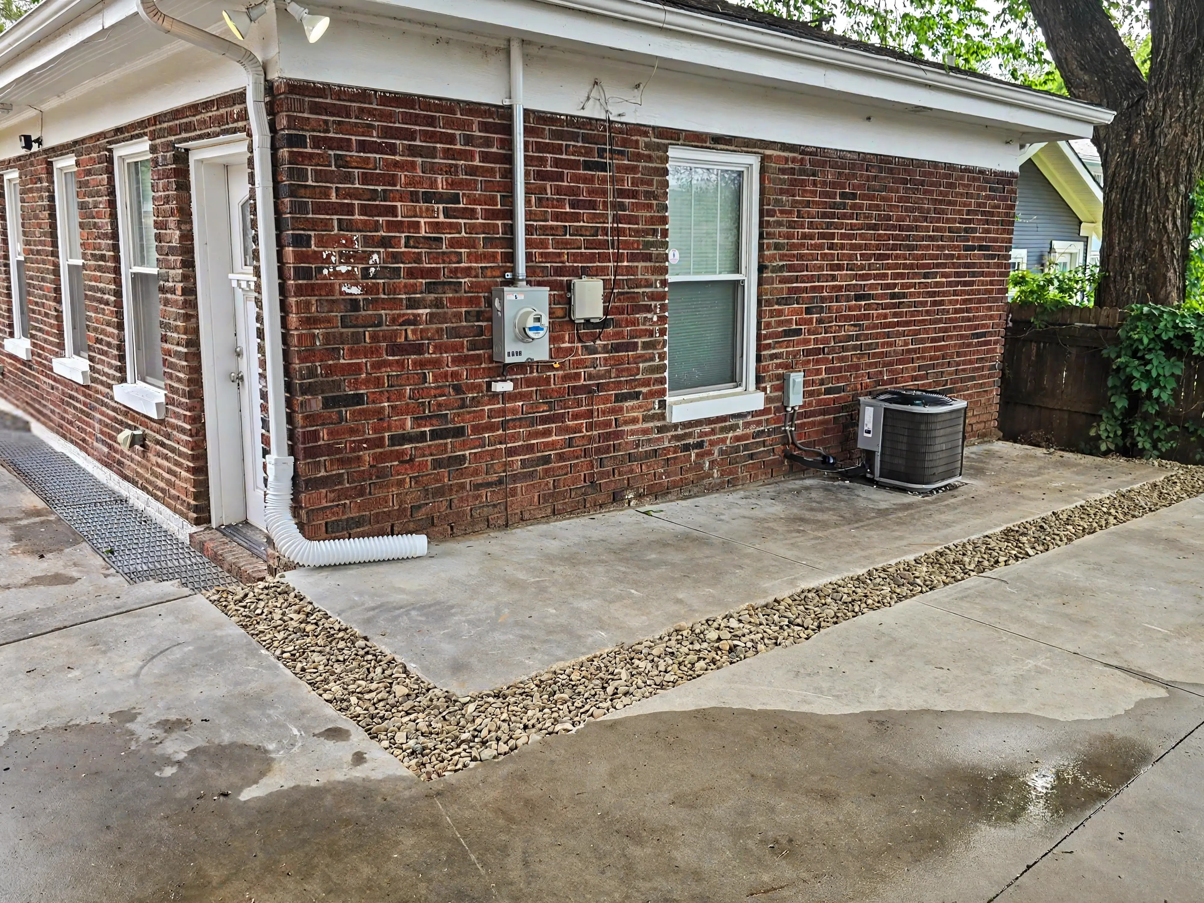French drain repair and concrete cutting after water intrusion work in Tulsa